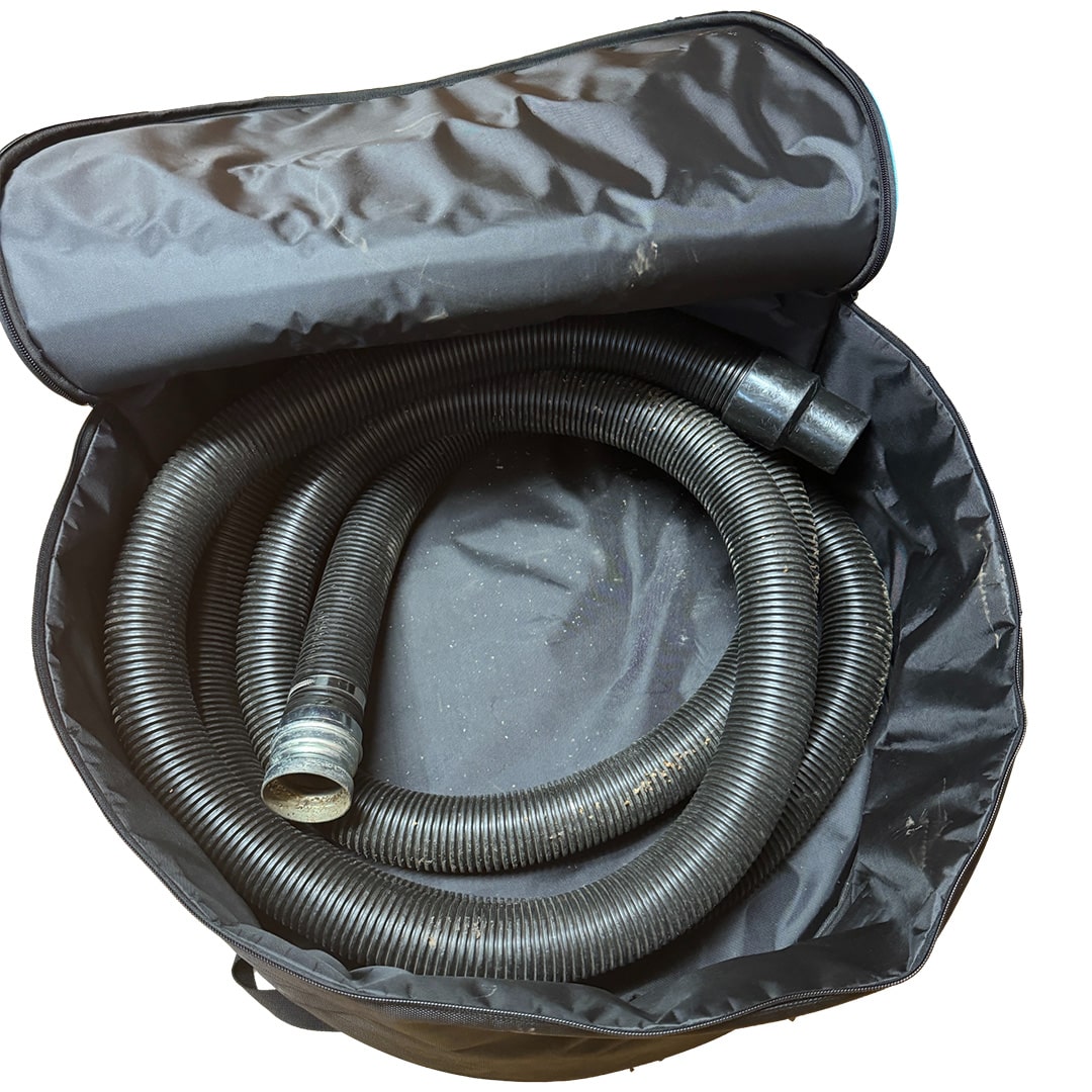 Top-down view of open Cyclone storage bag with coiled black gutter vacuum hose neatly placed inside