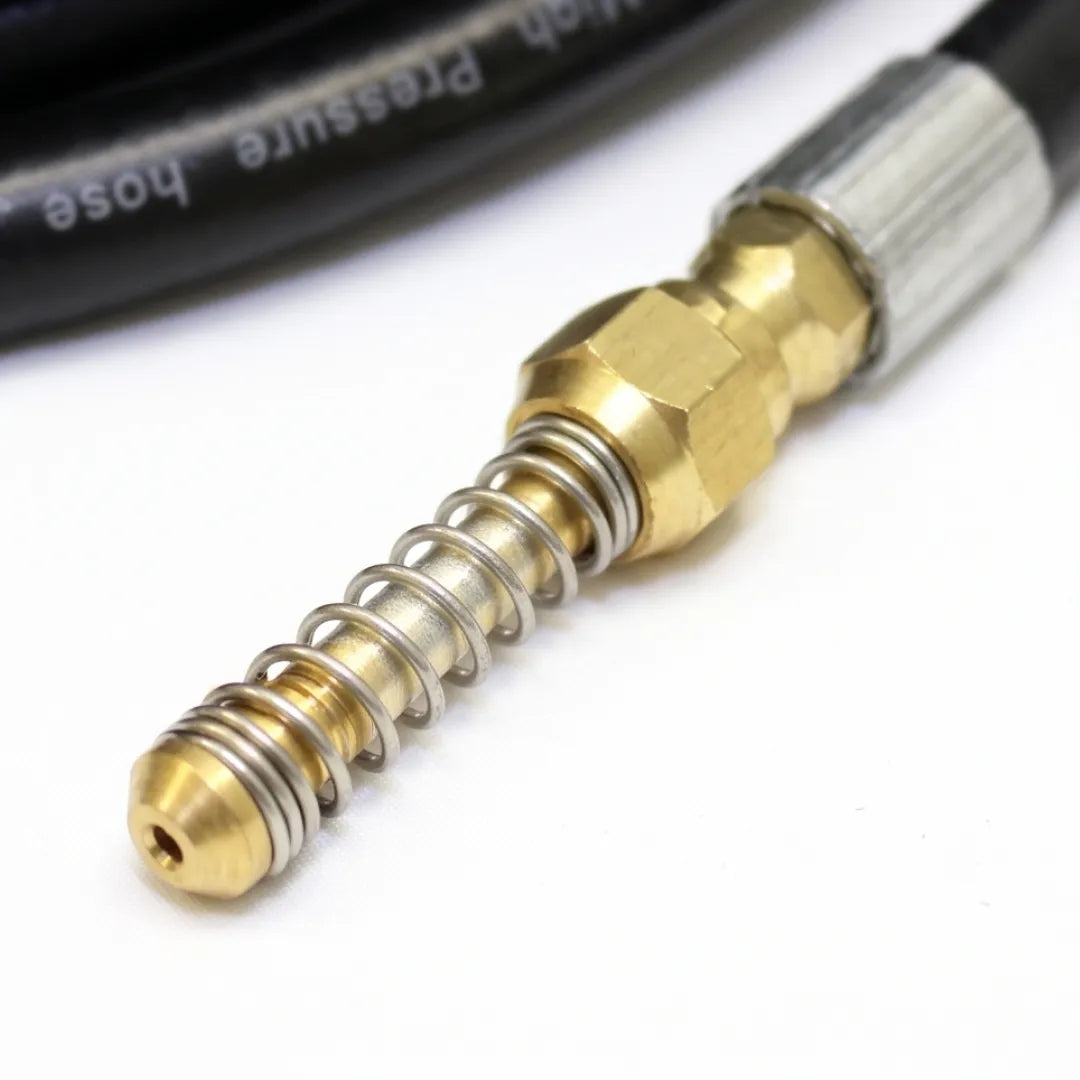 50 ft Flexible Drain & Downspout Jetter Hose - 1/4" NPT, 2300 PSI, Wiggle Nozzle, close-up of the brass nozzle wrapped in a silver spring